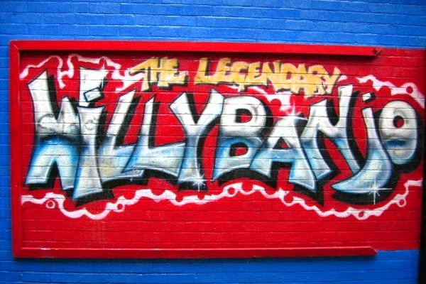 Andy Baron’s red and blue logo on the Willy Banjo shop exterior