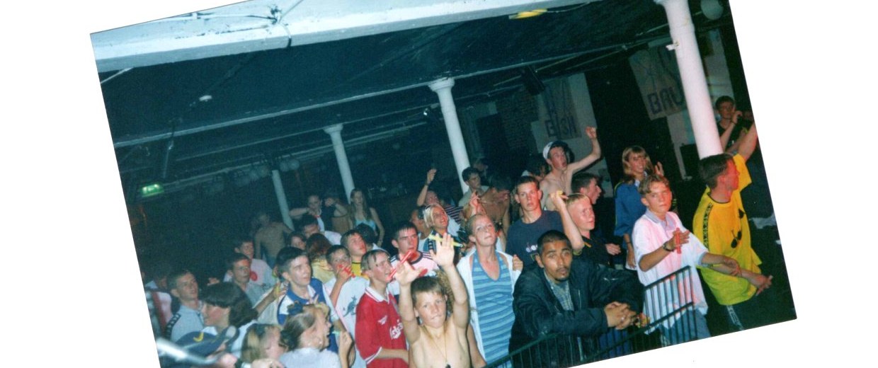 Crowd at Willy Banjo Xmas Bash with hands in the air