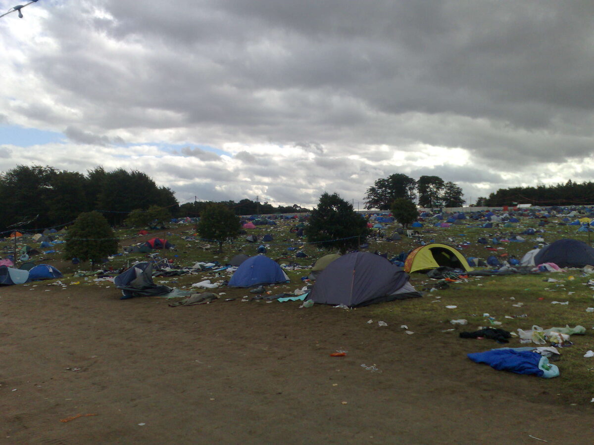Trashed, littered campsite the morning after the Leeds Festival riot