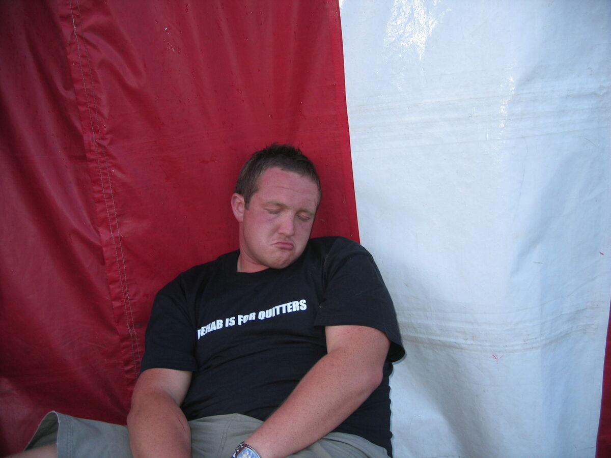 A very tired trader in a Rehab Is For Quitters t-shirt, the morning after