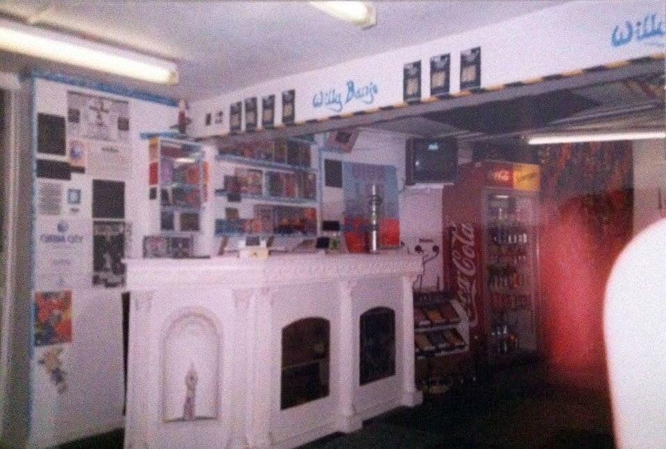 The Willy Banjo basement shop interior in the 1990s with the hand-built white counter