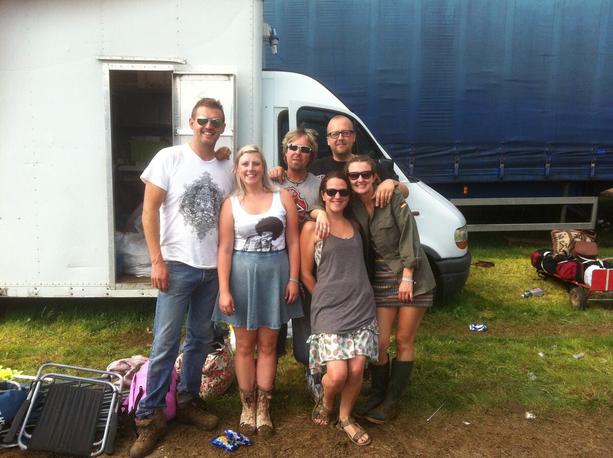 The Willy Banjo crew posing together in front of the van at Leeds Festival