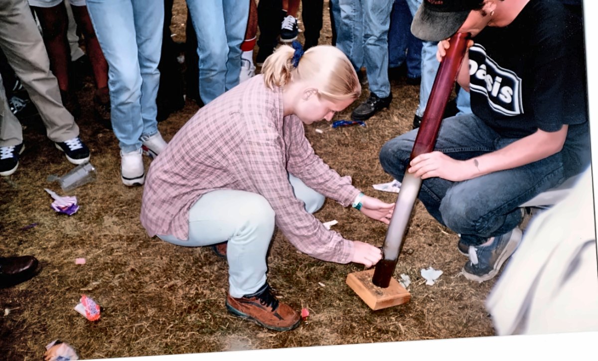 The four-foot acrylic bong on the grass at Oasis Knebworth 1996